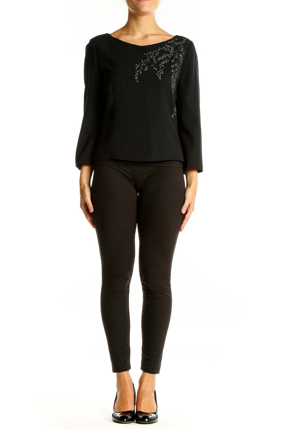 Front view of black LOFT top with embroidered neckline