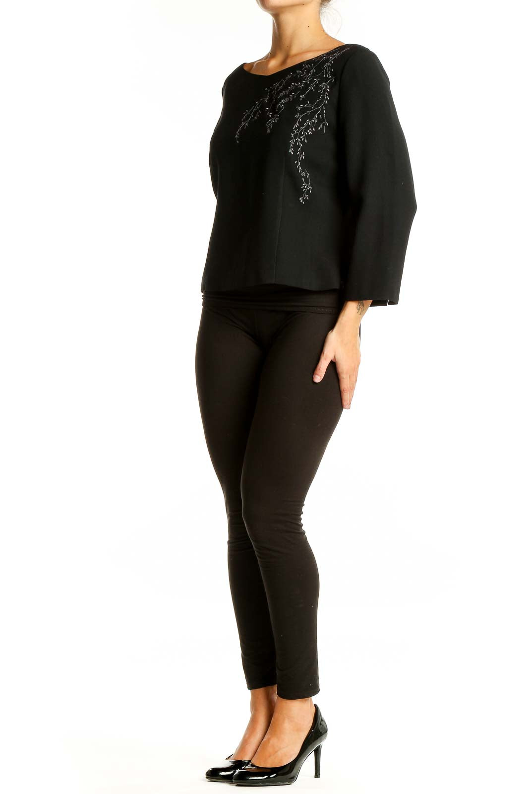 Front view of black LOFT top with embroidered neckline