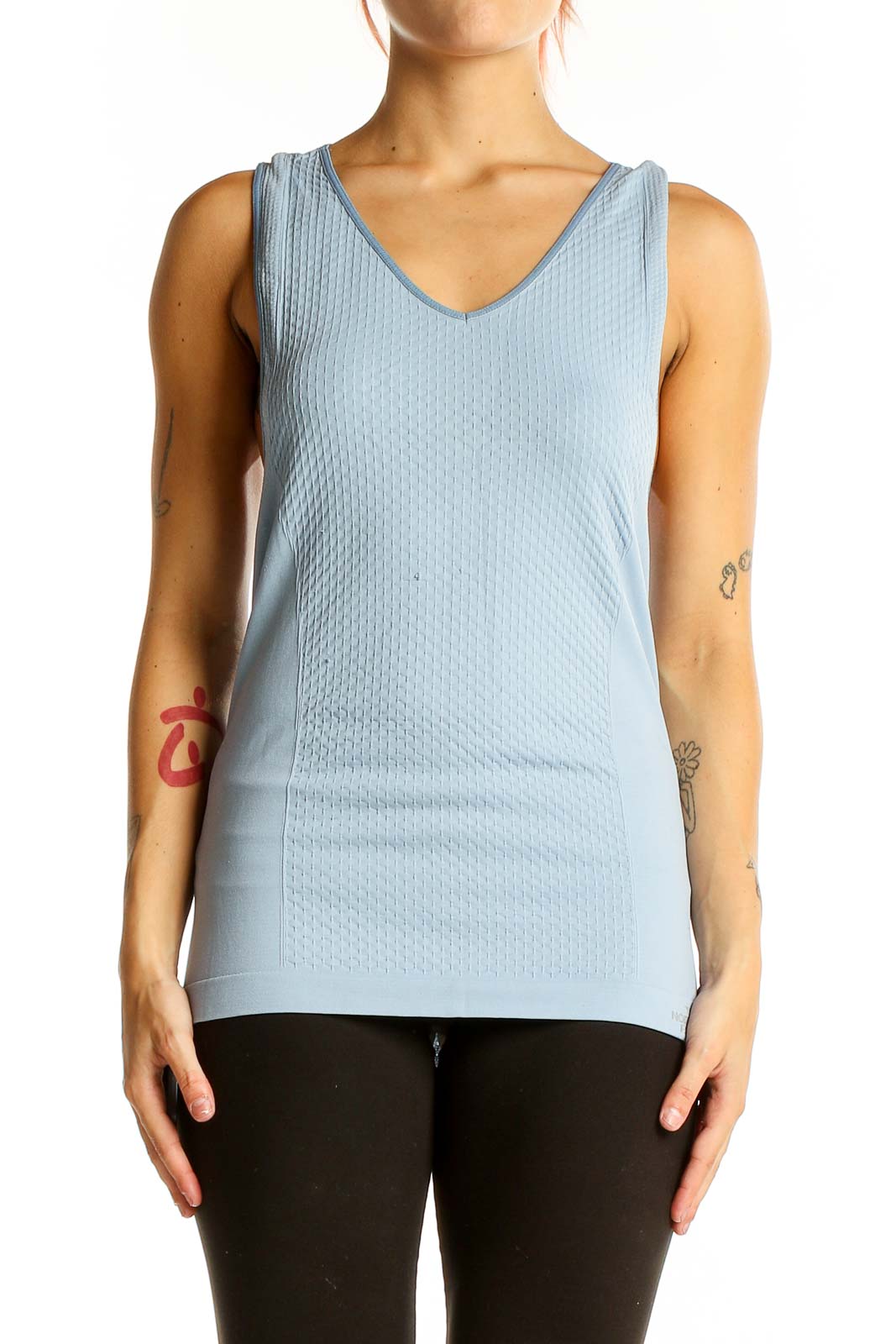 Front view of The North Face light blue textured racerback tank top