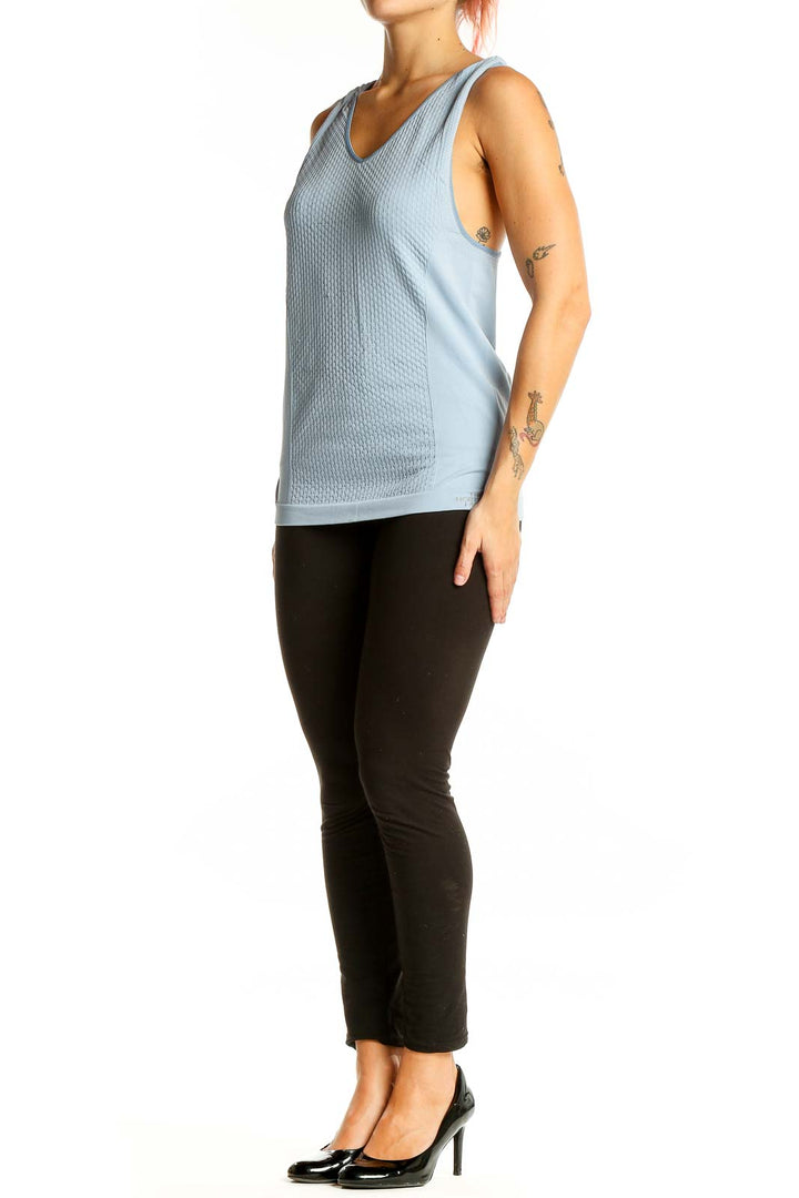 Front view of The North Face light blue textured racerback tank top