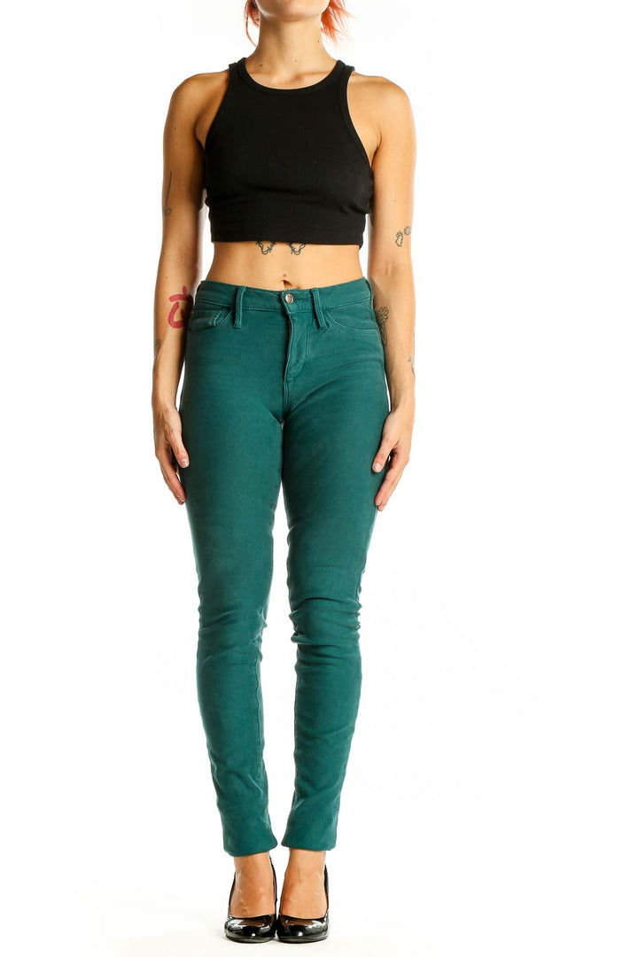 Front view of Joe's green skinny jeans on model