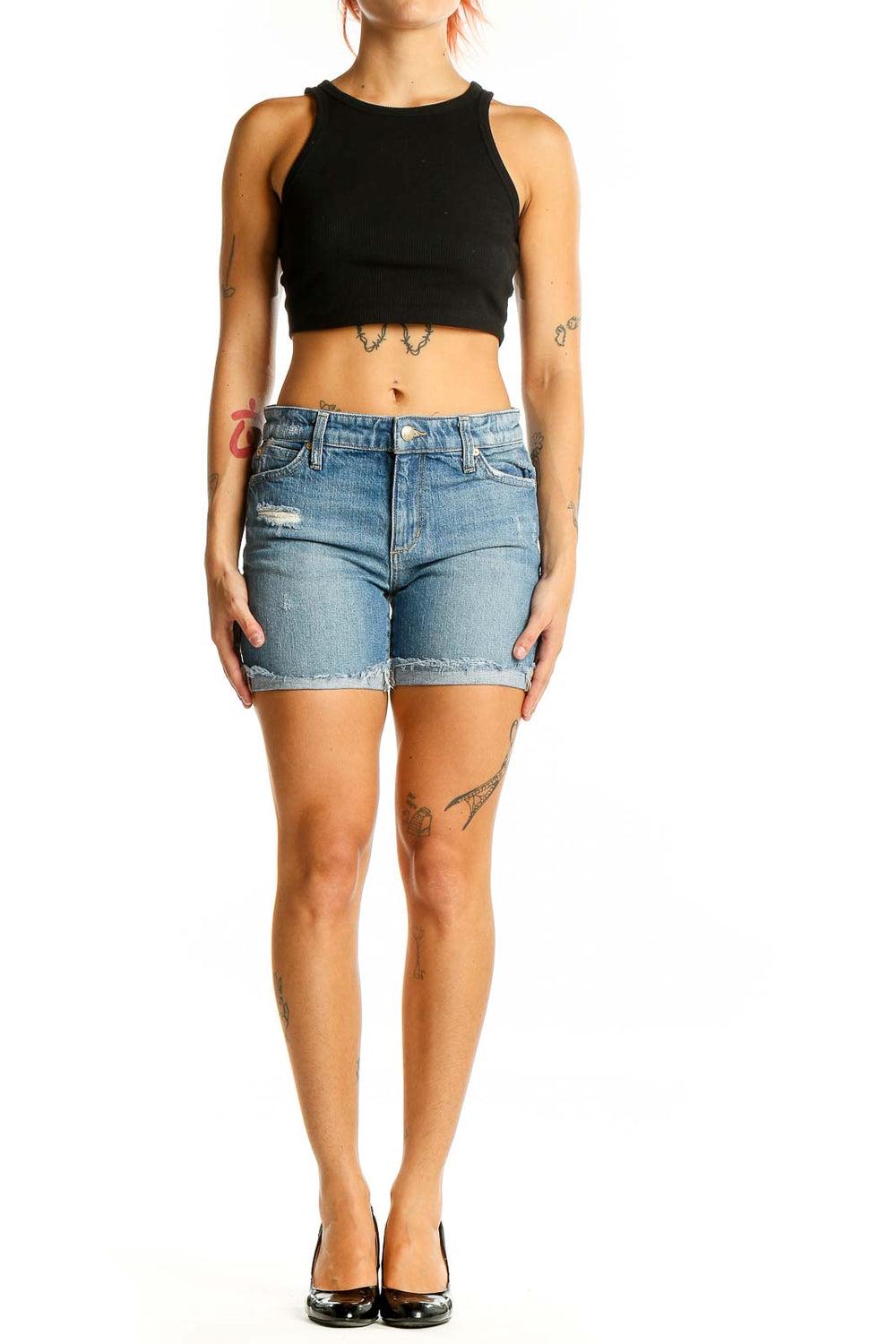 Front view of Joe's light blue distressed denim shorts on model