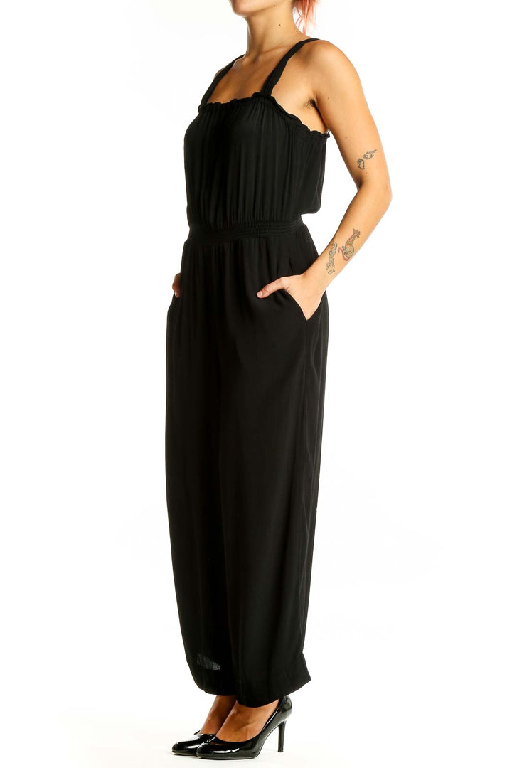 Front view of black Madewell wide-leg jumpsuit on model