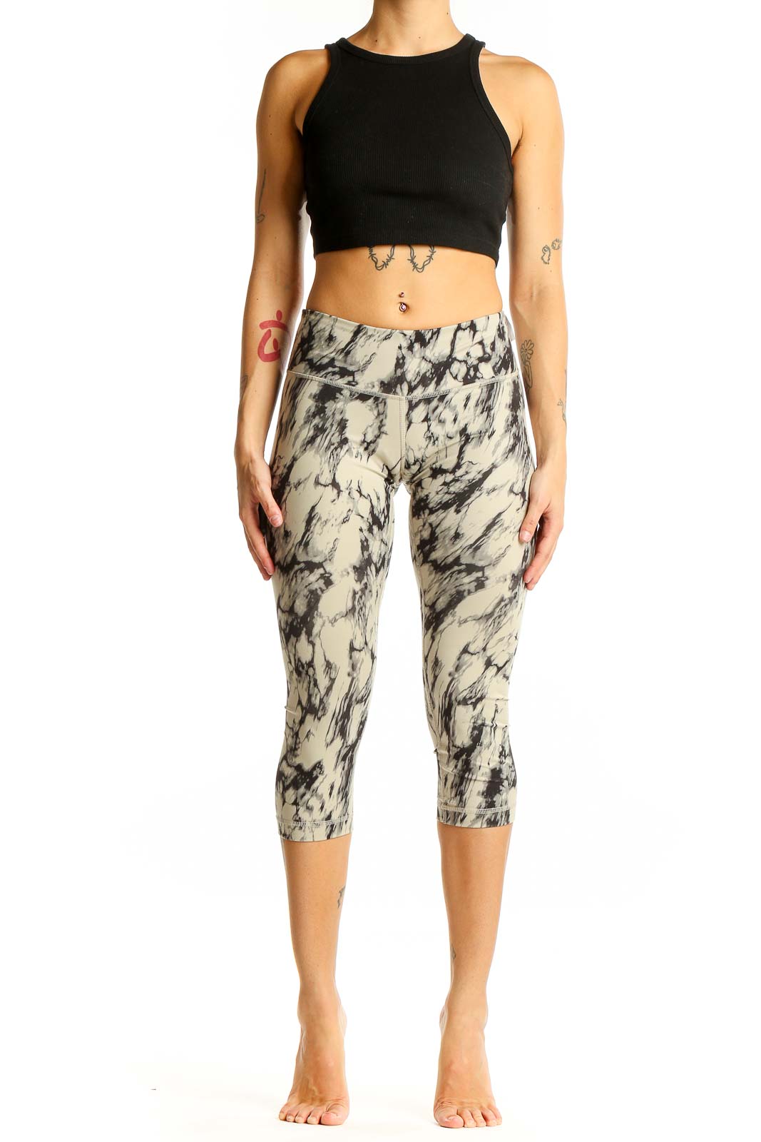 Front view of Lululemon beige marble print capri leggings