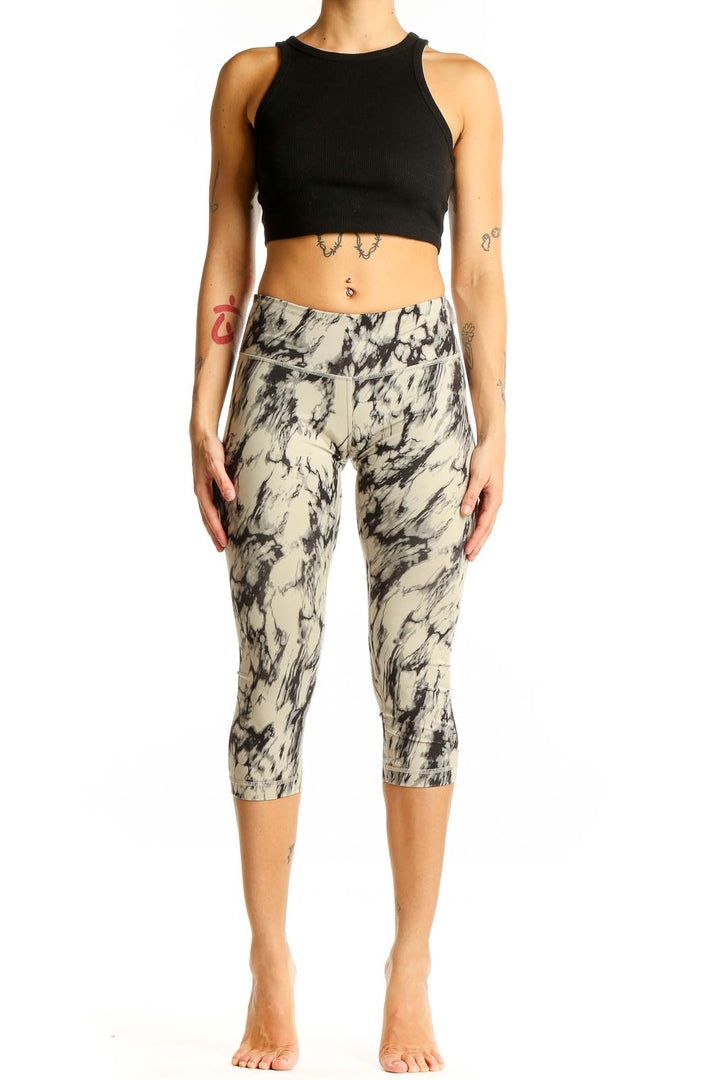 Front view of Lululemon beige marble print capri leggings