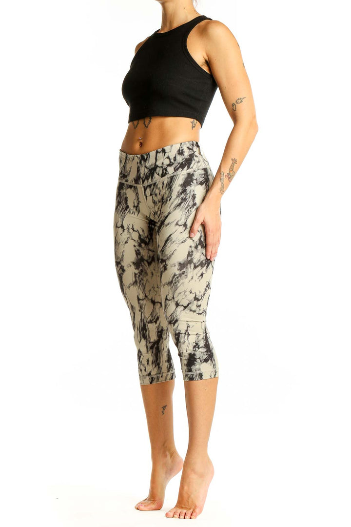 Front view of Lululemon beige marble print capri leggings