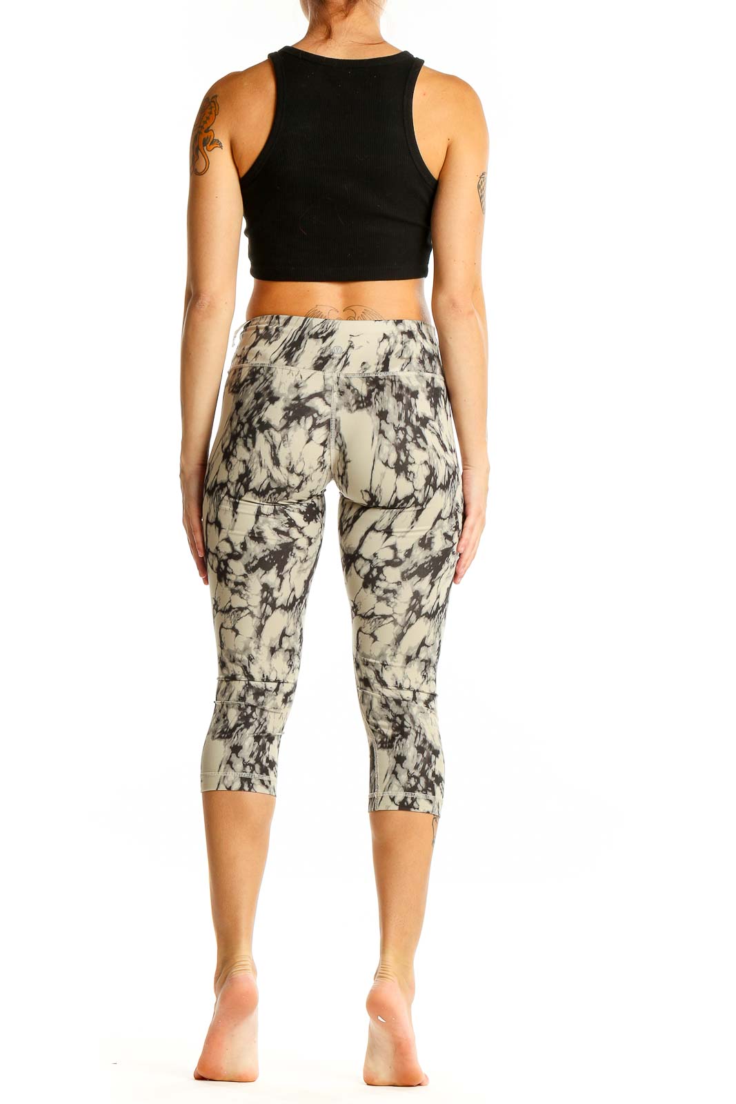 Back view of Lululemon beige marble print capri leggings