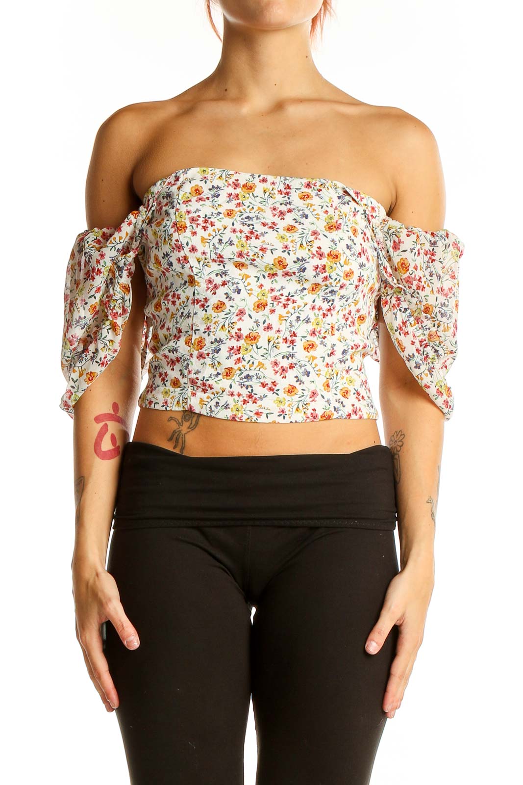 Front view of Flynn Skye floral off-shoulder crop top with puffed sleeves