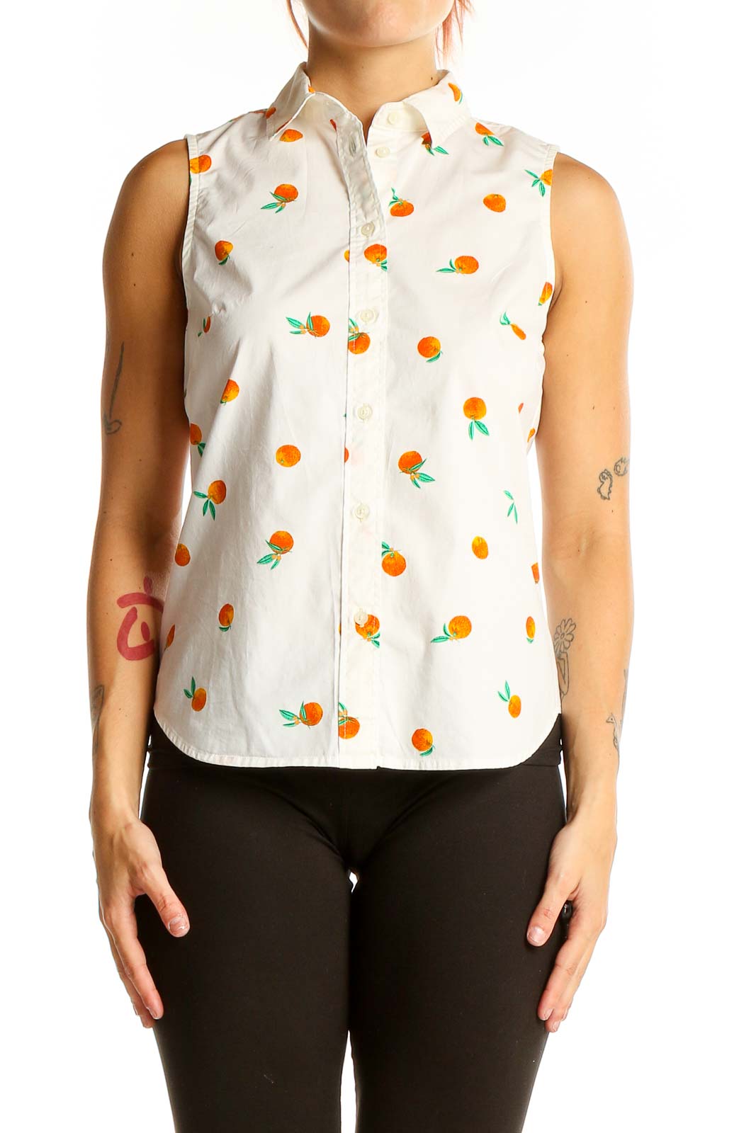 Front view of J.Crew white sleeveless button-up shirt with orange fruit print