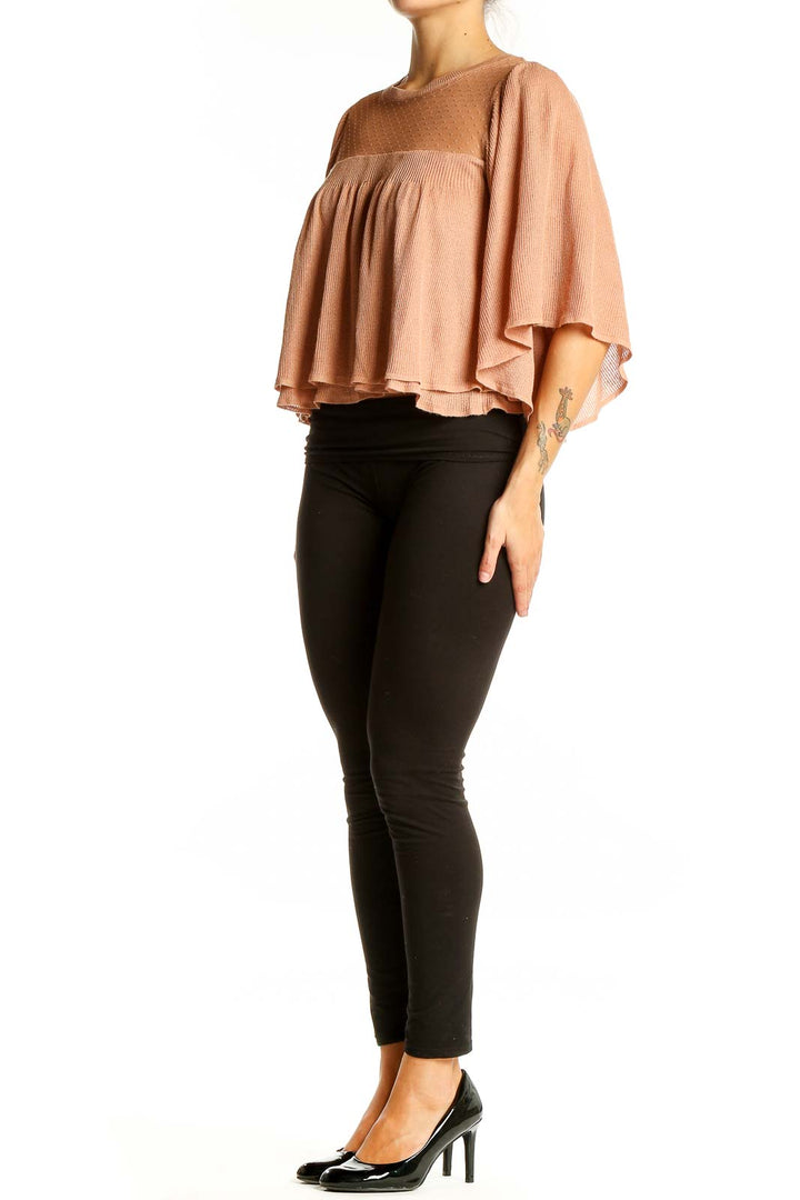 Front view of Zara blush cropped blouse with sheer dotted yoke