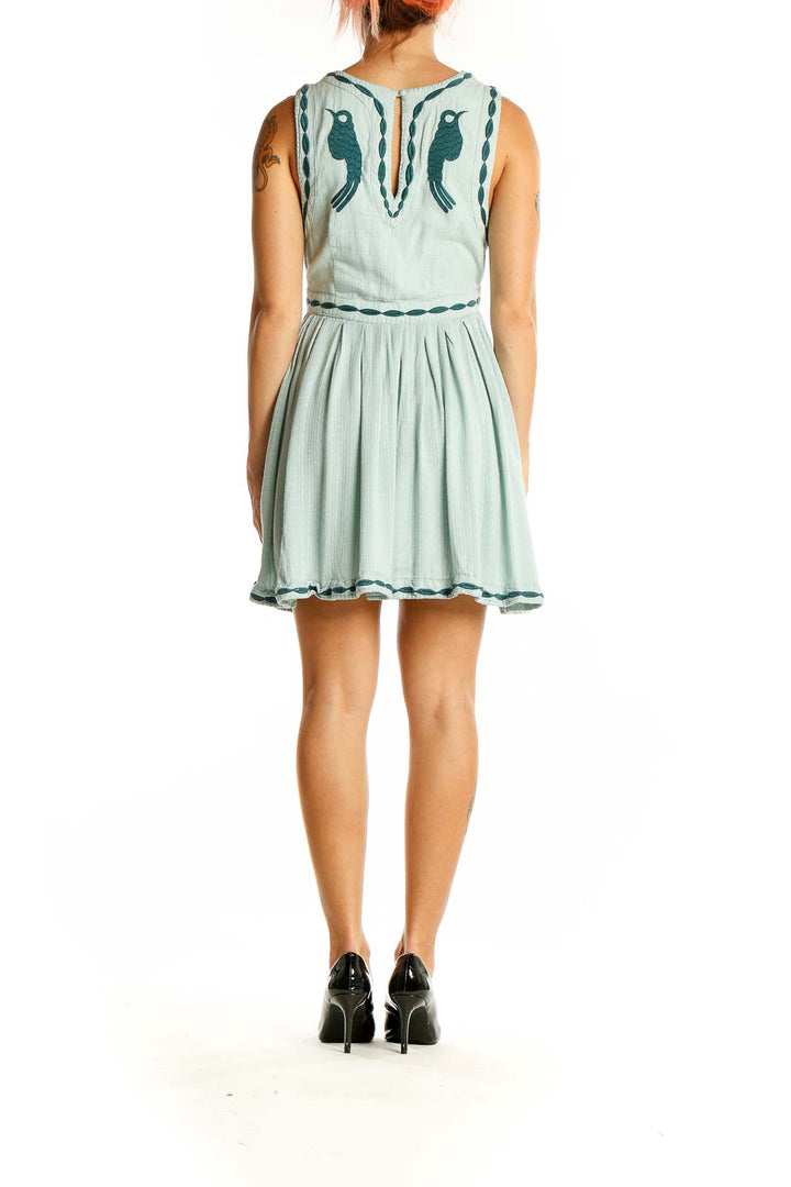 Back view of Free People mint mini dress showing keyhole detail and embroidery