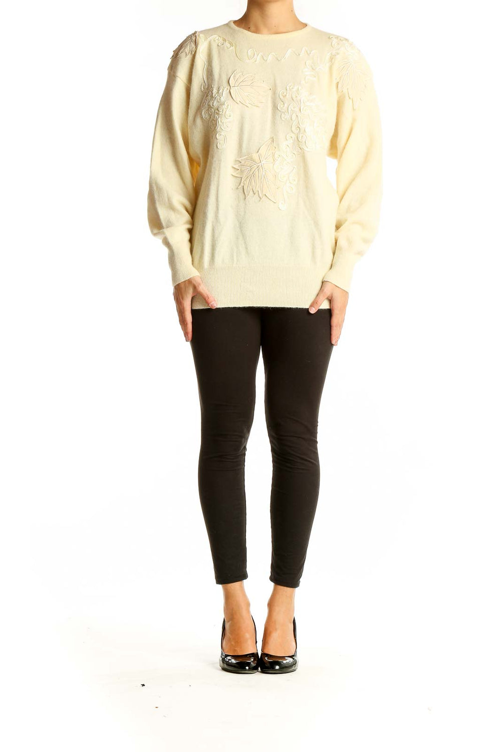 Front view of cream embroidered luxury knit sweater with leaf patterns