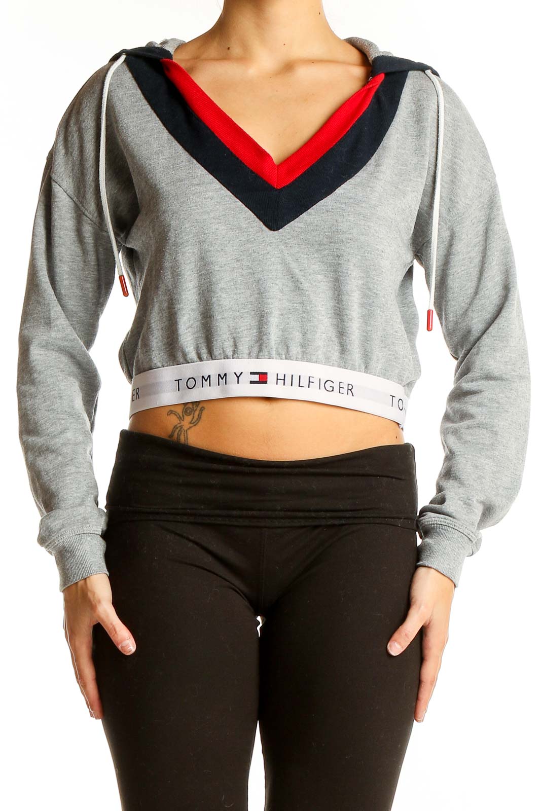 Front view of Tommy Hilfiger gray cropped hoodie with V-neck and color blocking