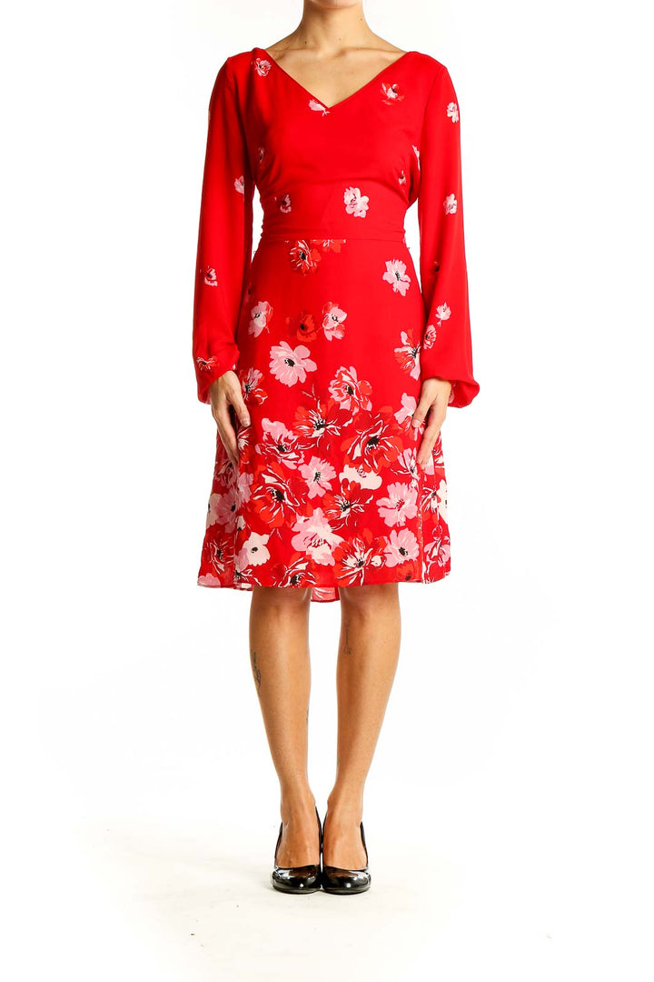 Front view of red floral long sleeve V-neck dress from White House Black Market