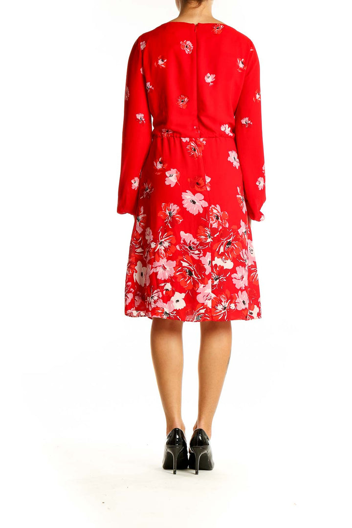 Back view of red floral long sleeve V-neck dress from White House Black Market