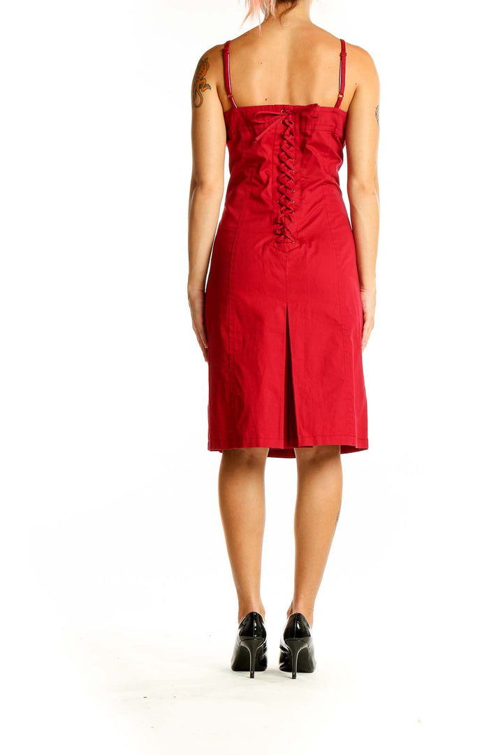 Back view of red Tommy Hilfiger midi dress showcasing lace-up detail