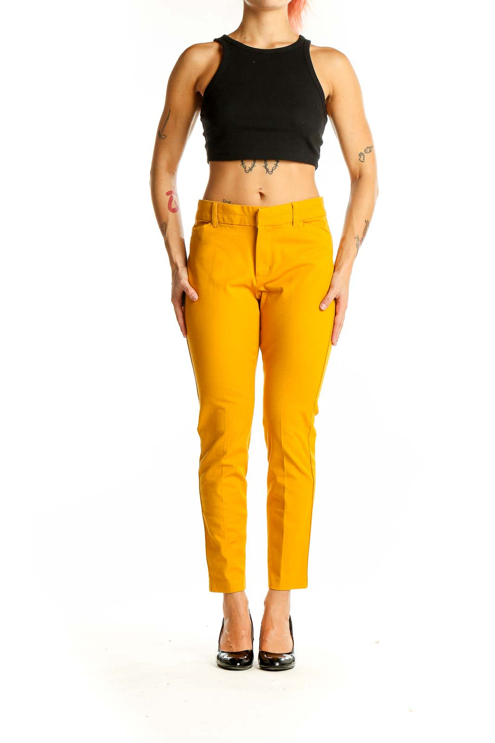 Front view of Gap yellow slim-fit trousers on model