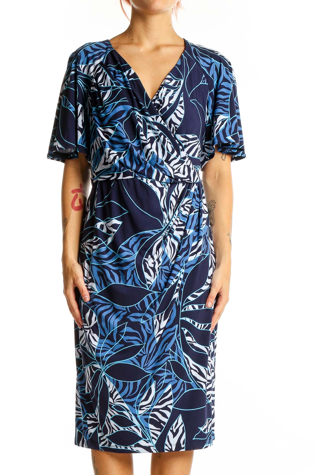 Front view of Maggy London Navy Tropical Print Wrap Midi Dress with V-neckline and flutter sleeves