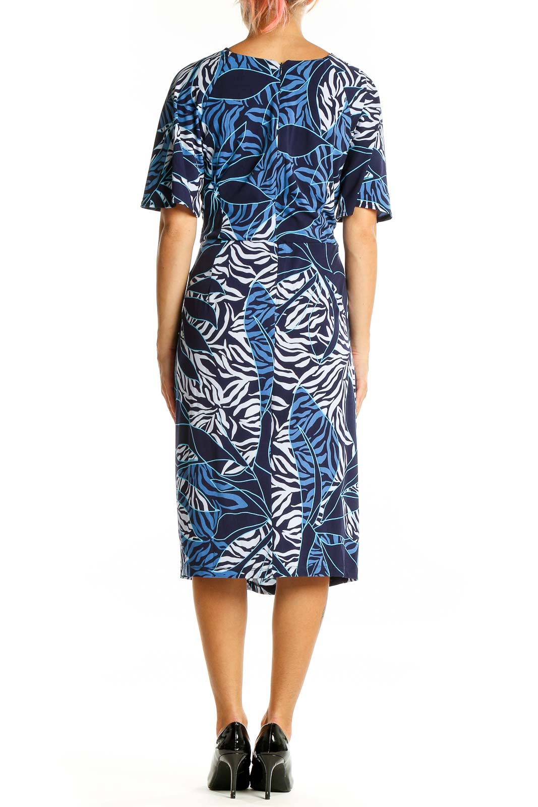 Back view of Maggy London Navy Tropical Print Wrap Midi Dress showing all-over leaf print design