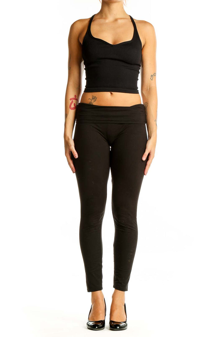 Front view of Free People Movement black ribbed racerback crop top