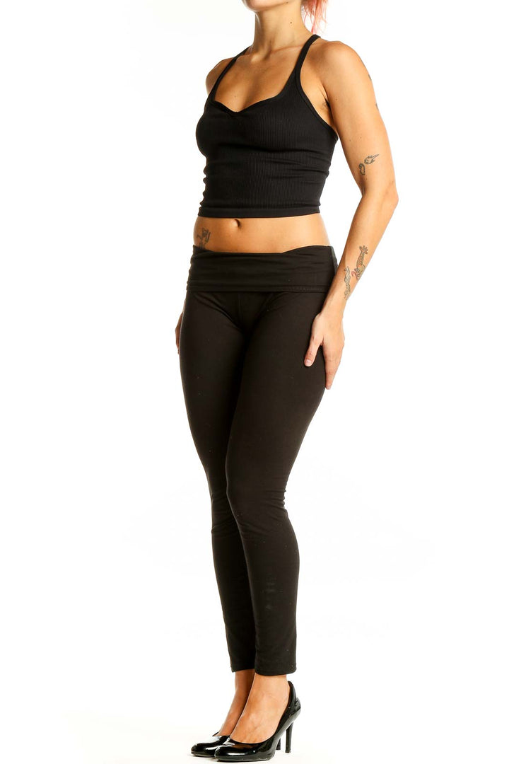 Front view of Free People Movement black ribbed racerback crop top