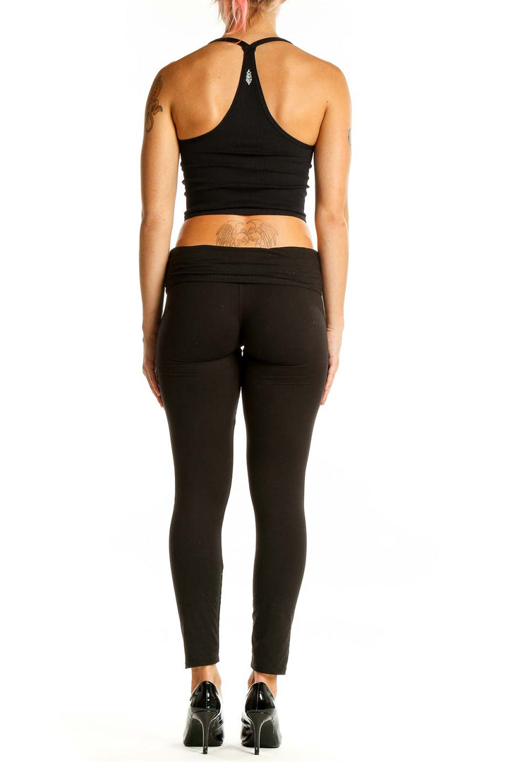 Back view of Free People Movement black ribbed racerback crop top