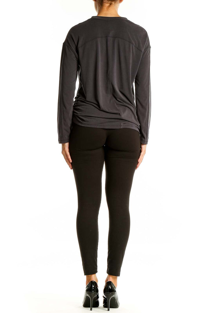 Back view of gray Lululemon long sleeve activewear top