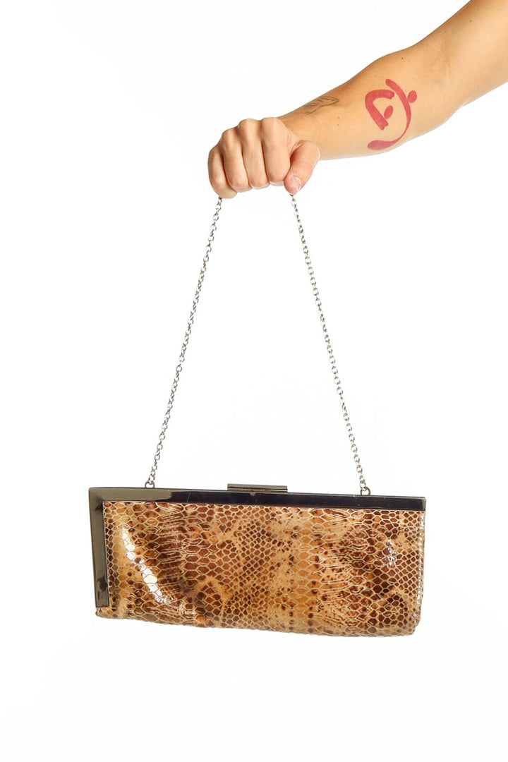 Front view of Calvin Klein brown snakeskin print clutch with chain strap