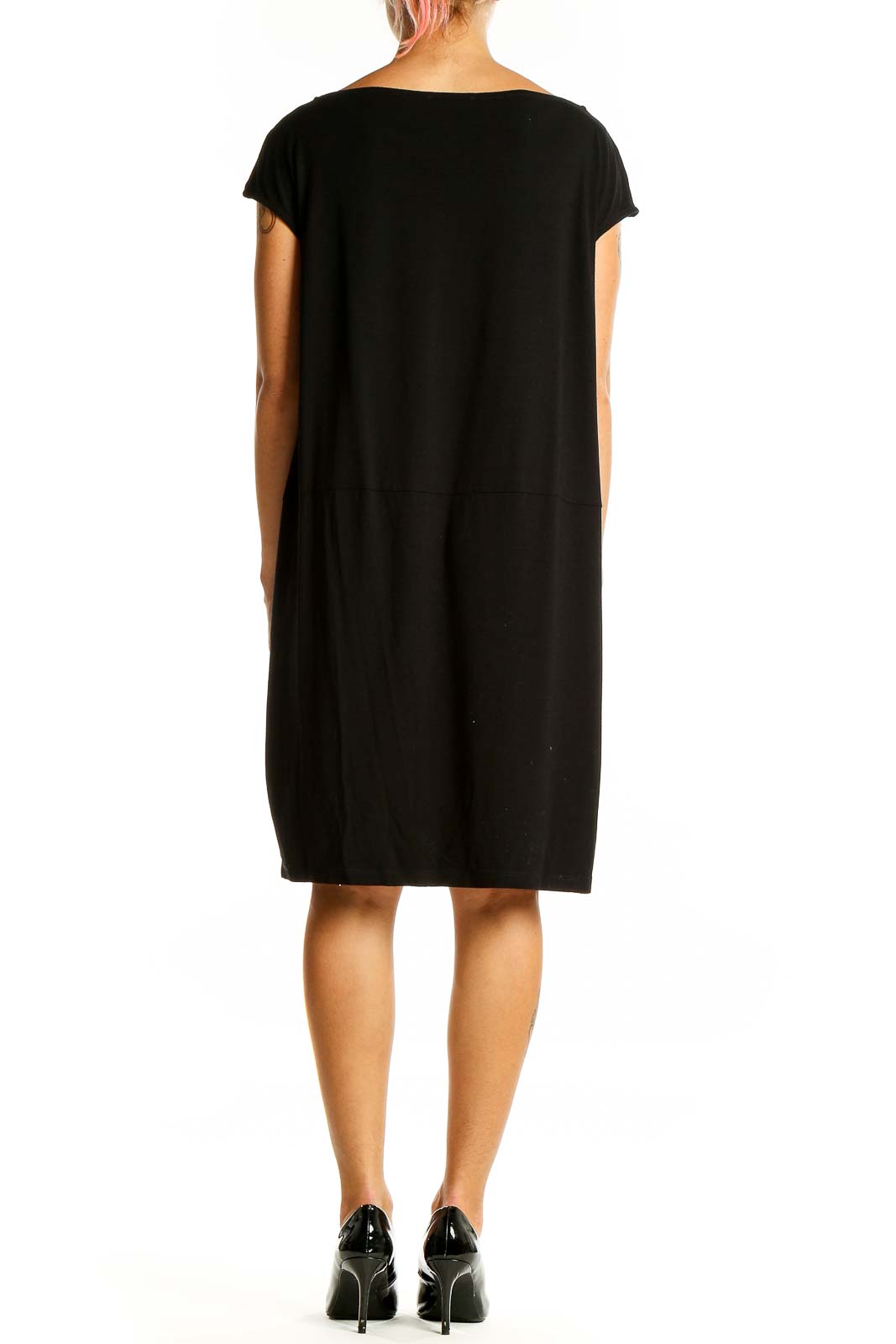 Back view of black Eileen Fisher cap-sleeve dress on model