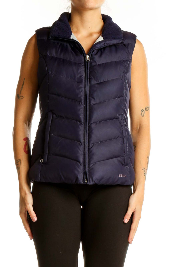 Front view of Eddie Bauer navy quilted down puffer vest on model