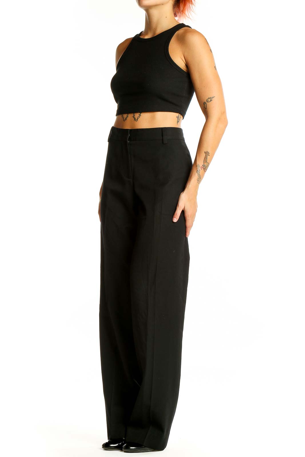 Front view of DKNY black wool wide-leg trousers on model