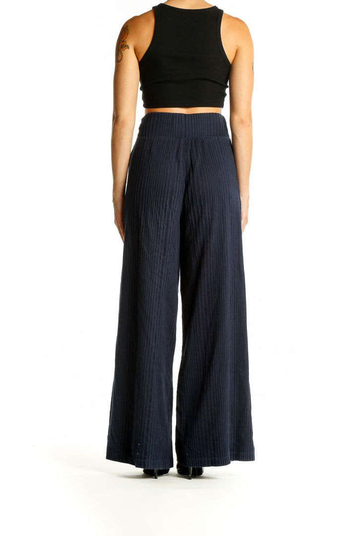 Back view of Gap navy ribbed wide-leg pants showing relaxed fit