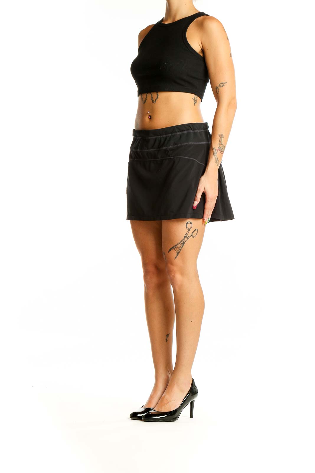 Front view of black Athleta athletic skort with wide waistband