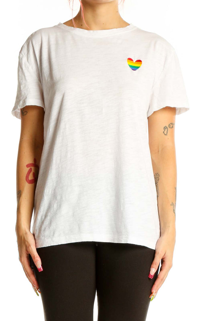 White LOFT t-shirt with small rainbow heart graphic on chest