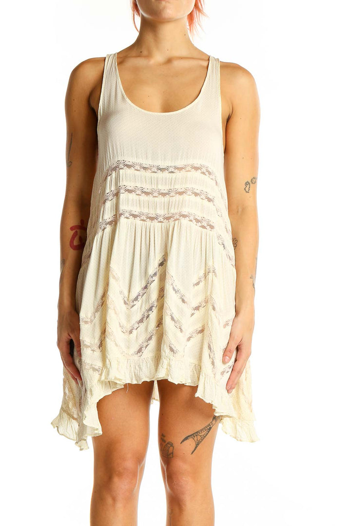 Front view of Intimately Free People ivory lace-trimmed flowy mini dress