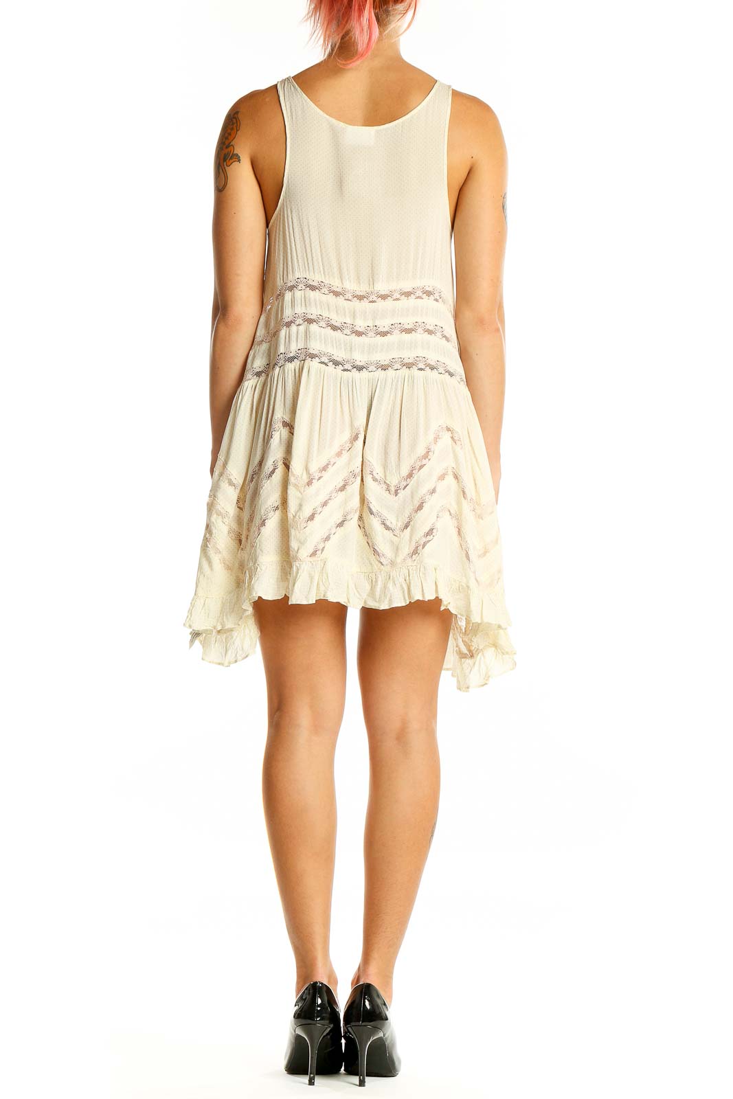 Back view of Intimately Free People ivory lace-trimmed flowy mini dress showing racerback design