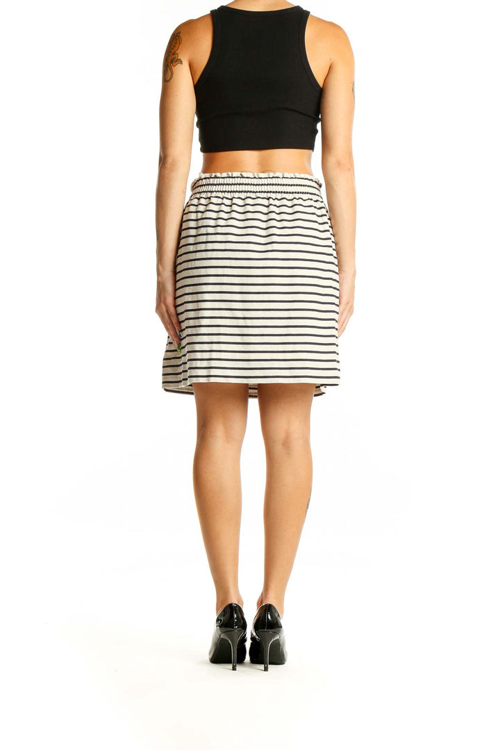 Back view of J.Crew white and navy striped cotton-linen skirt on model