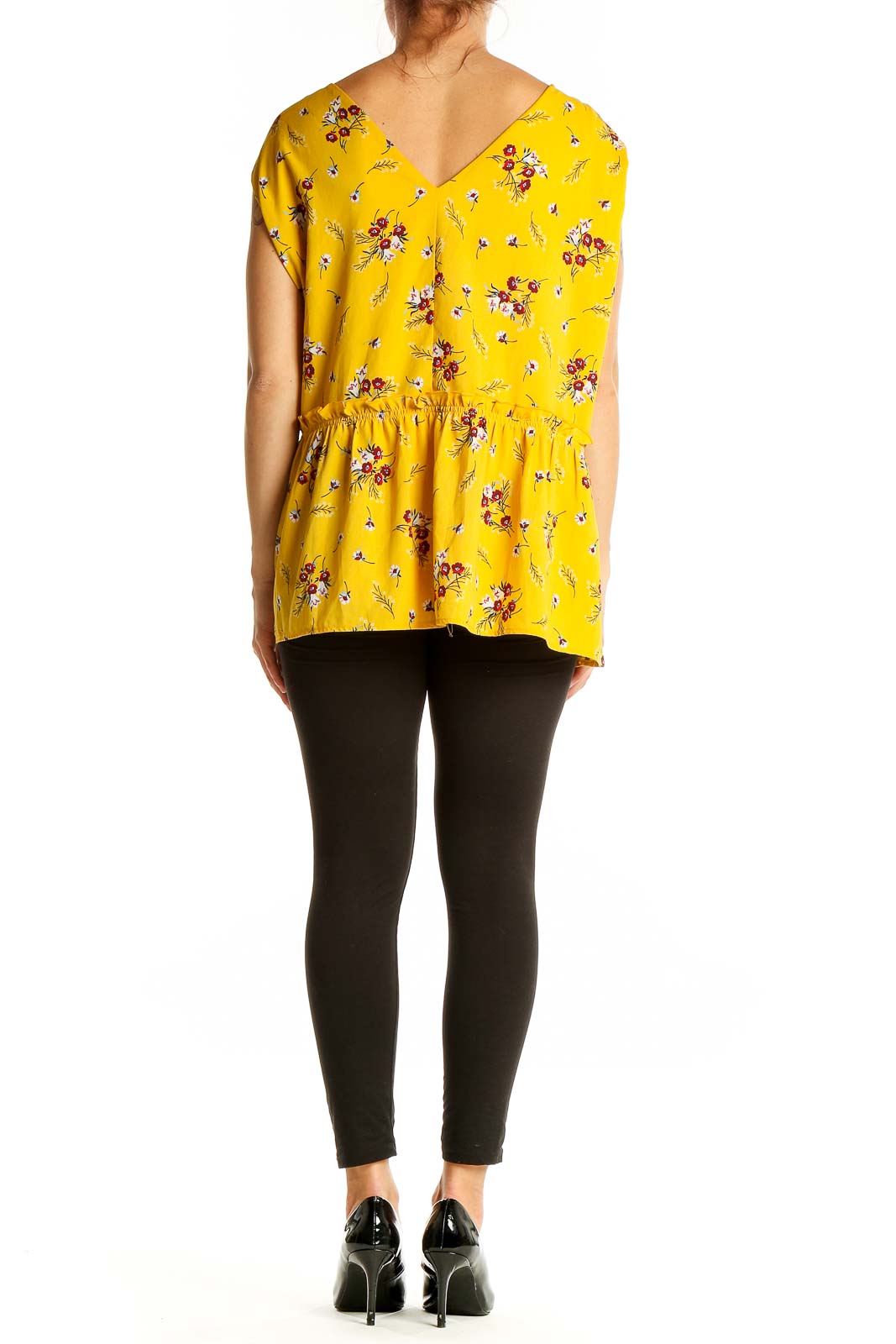 Back view of LOFT yellow floral peplum blouse showing peplum waist detail