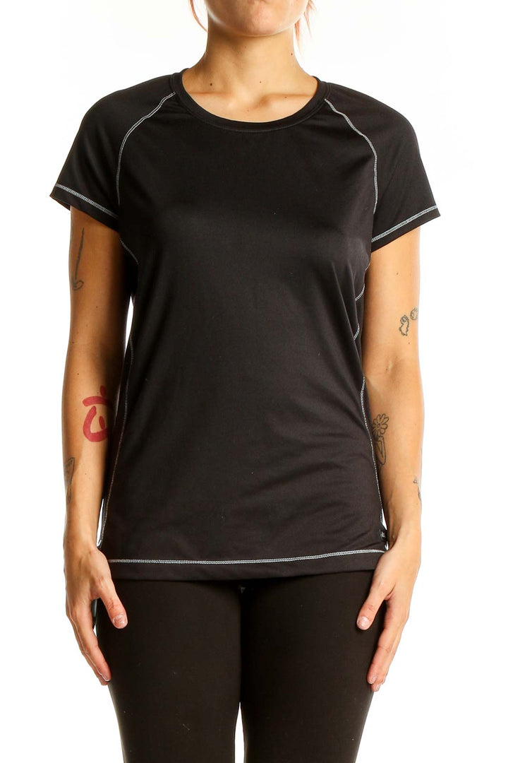 Front view of black Alo performance short sleeve top with white stitching