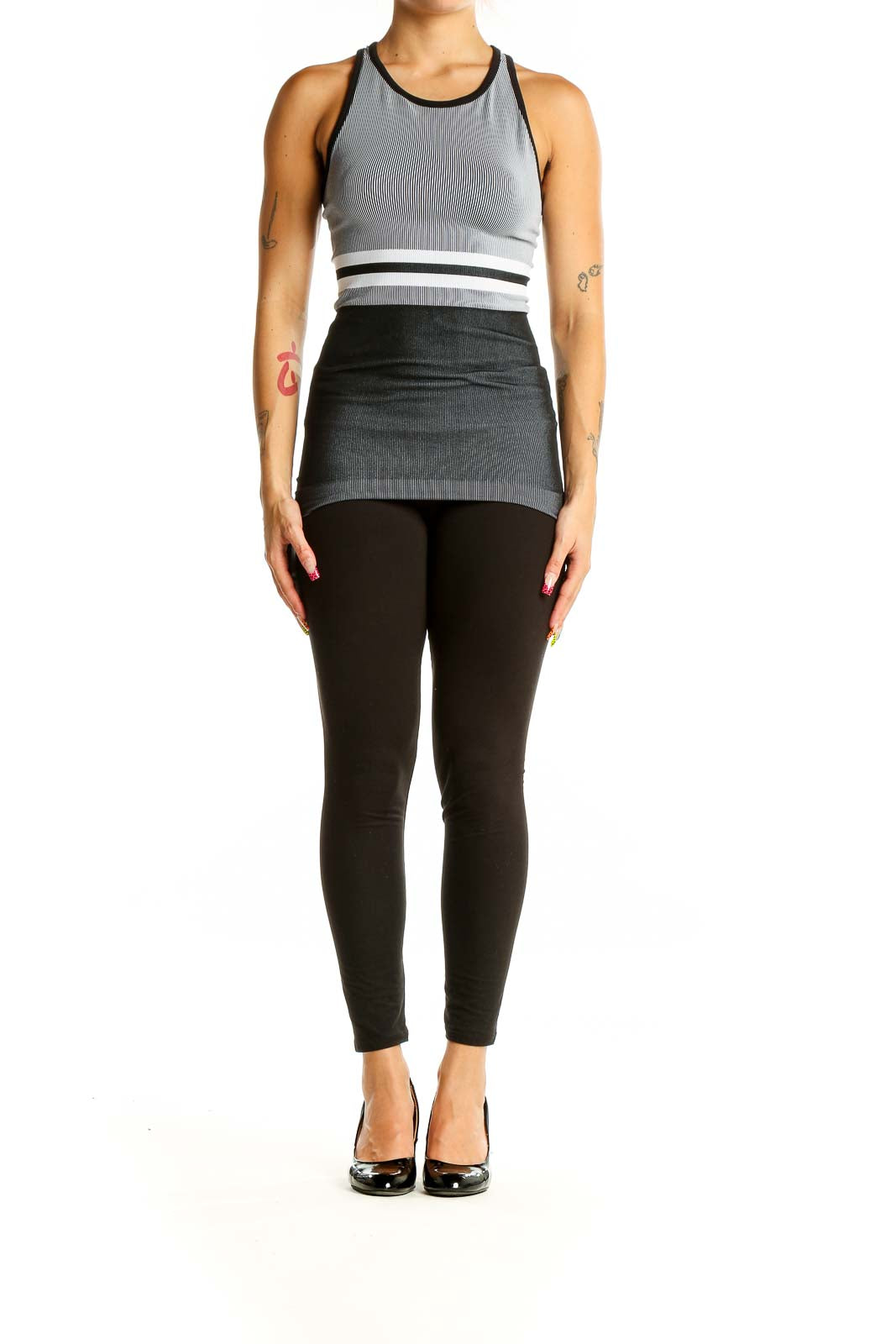 Front view of gray striped Athleta racerback tank top with white waistband detail