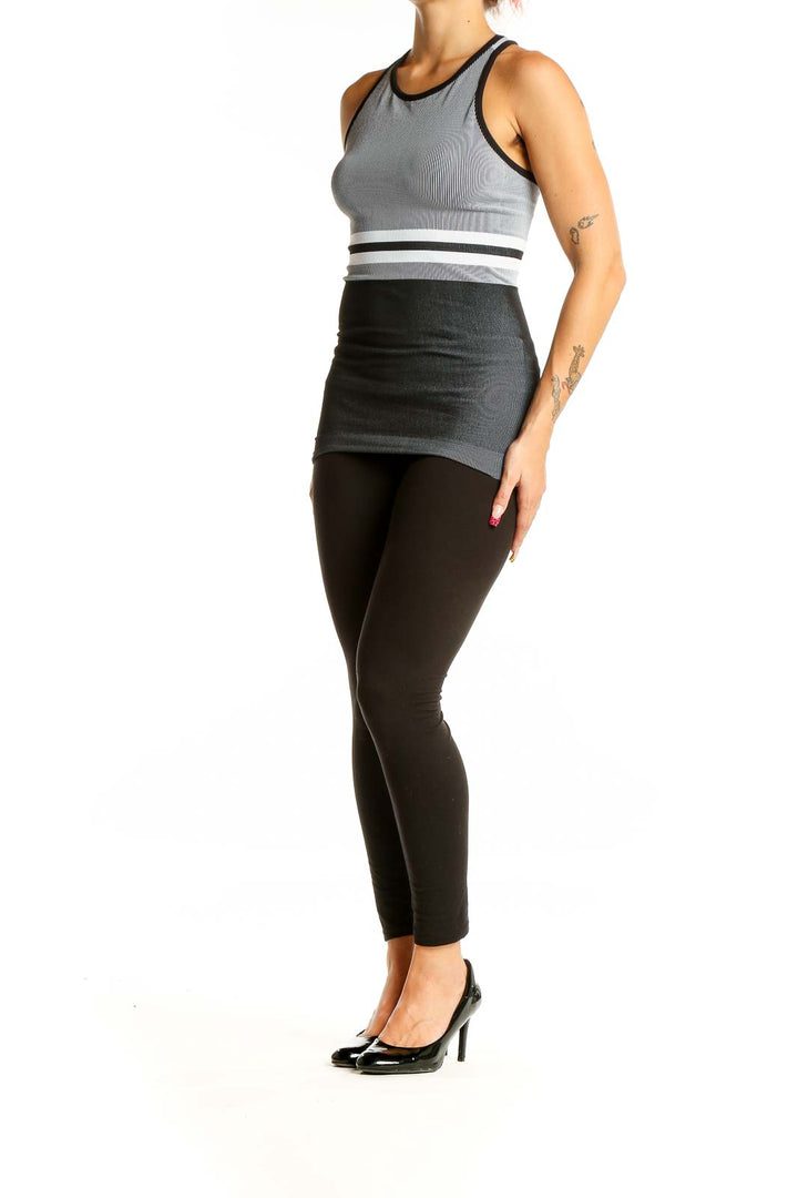 Front view of gray striped Athleta racerback tank top with white waistband detail