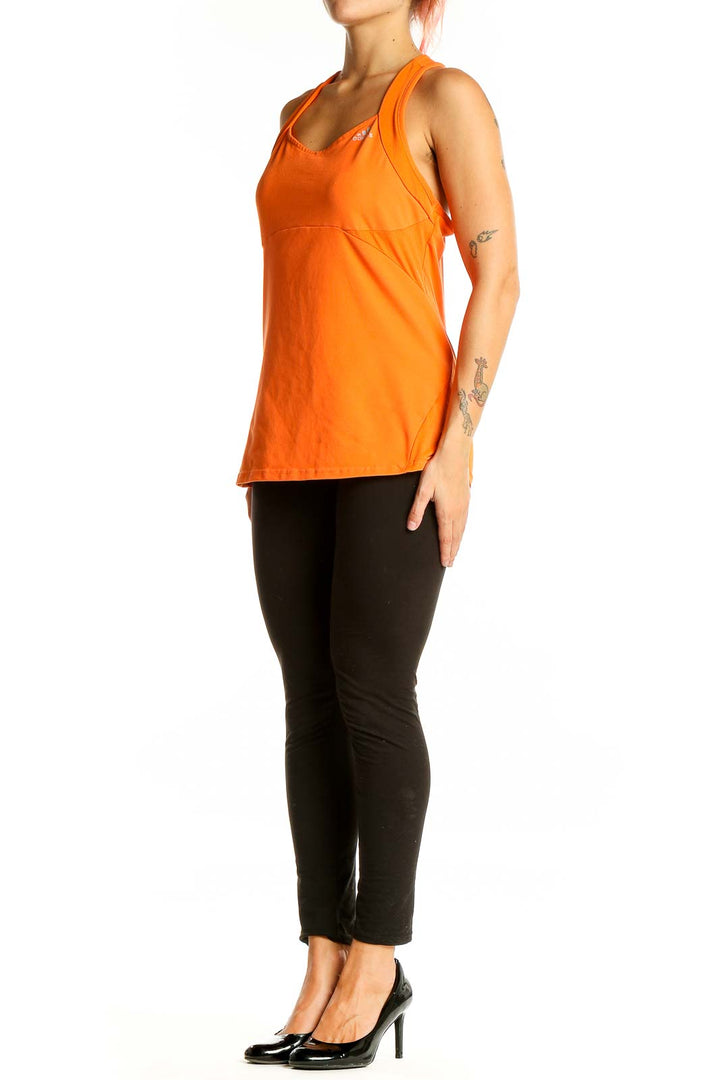 Front view of orange Adidas racerback performance tank top