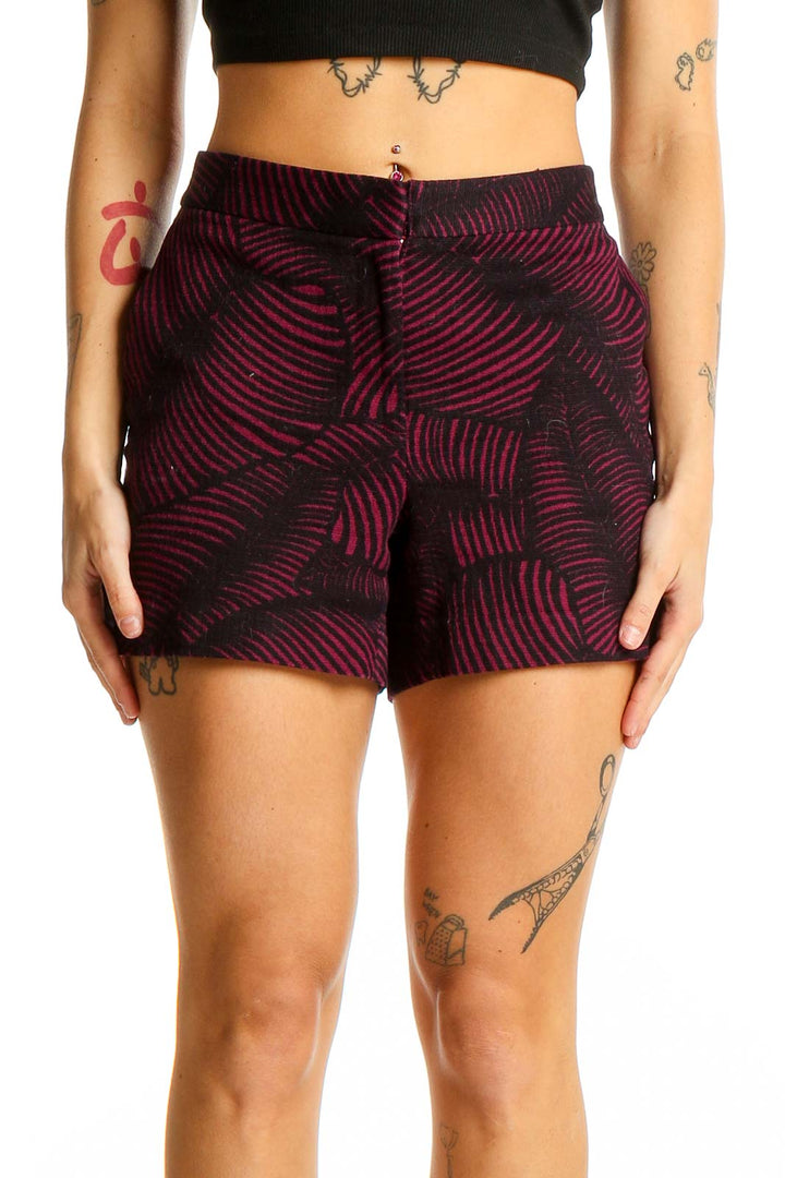 Front view of Ann Taylor burgundy shorts with black leaf-like pattern