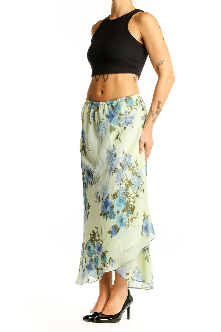 Front view of SilkRoll mint floral maxi skirt with blue flowers