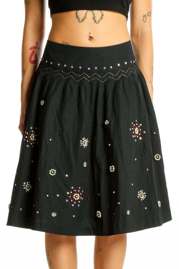 Front view of Odille black cotton A-line skirt with sequin embellishments