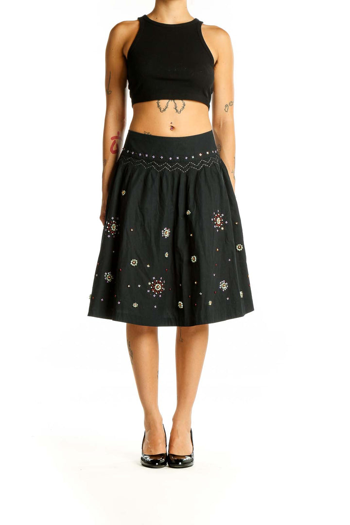 Front view of Odille black cotton A-line skirt with sequin embellishments