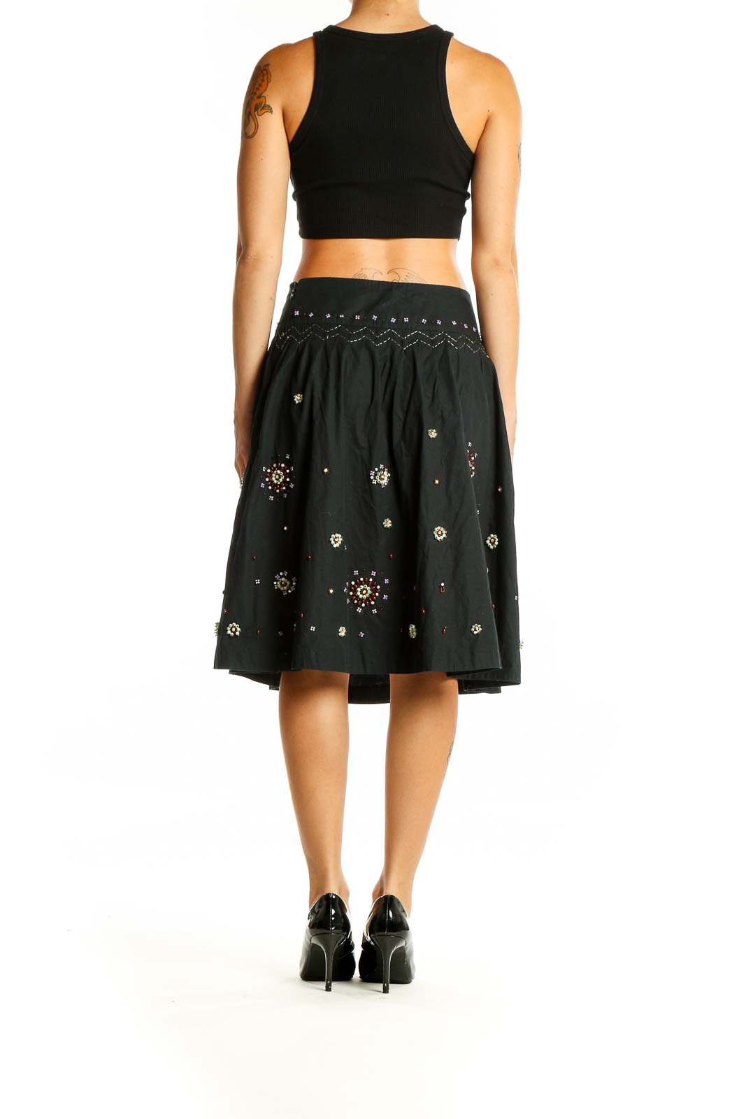 Back view of Odille black cotton A-line skirt showing sequin pattern