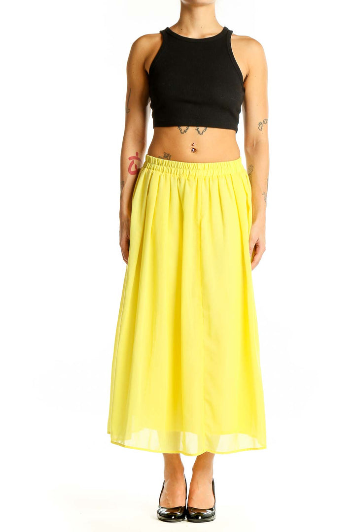 Front view of yellow flowy midi skirt by Sonny Lable