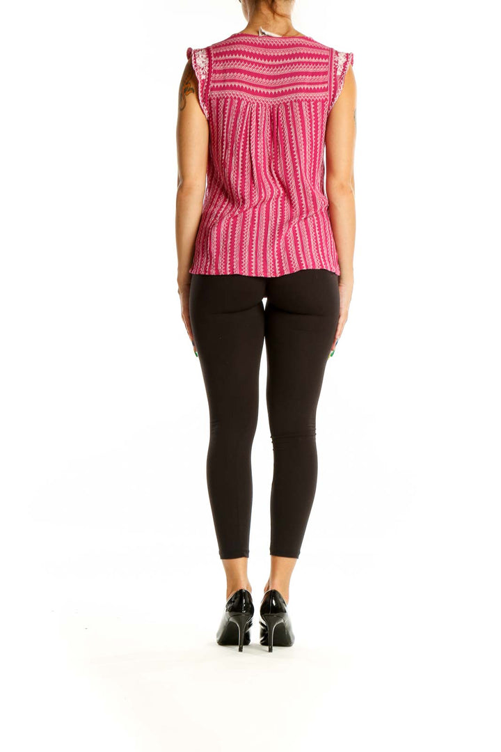 Back view of pink sleeveless top showing vertical stripe pattern and embroidered yoke