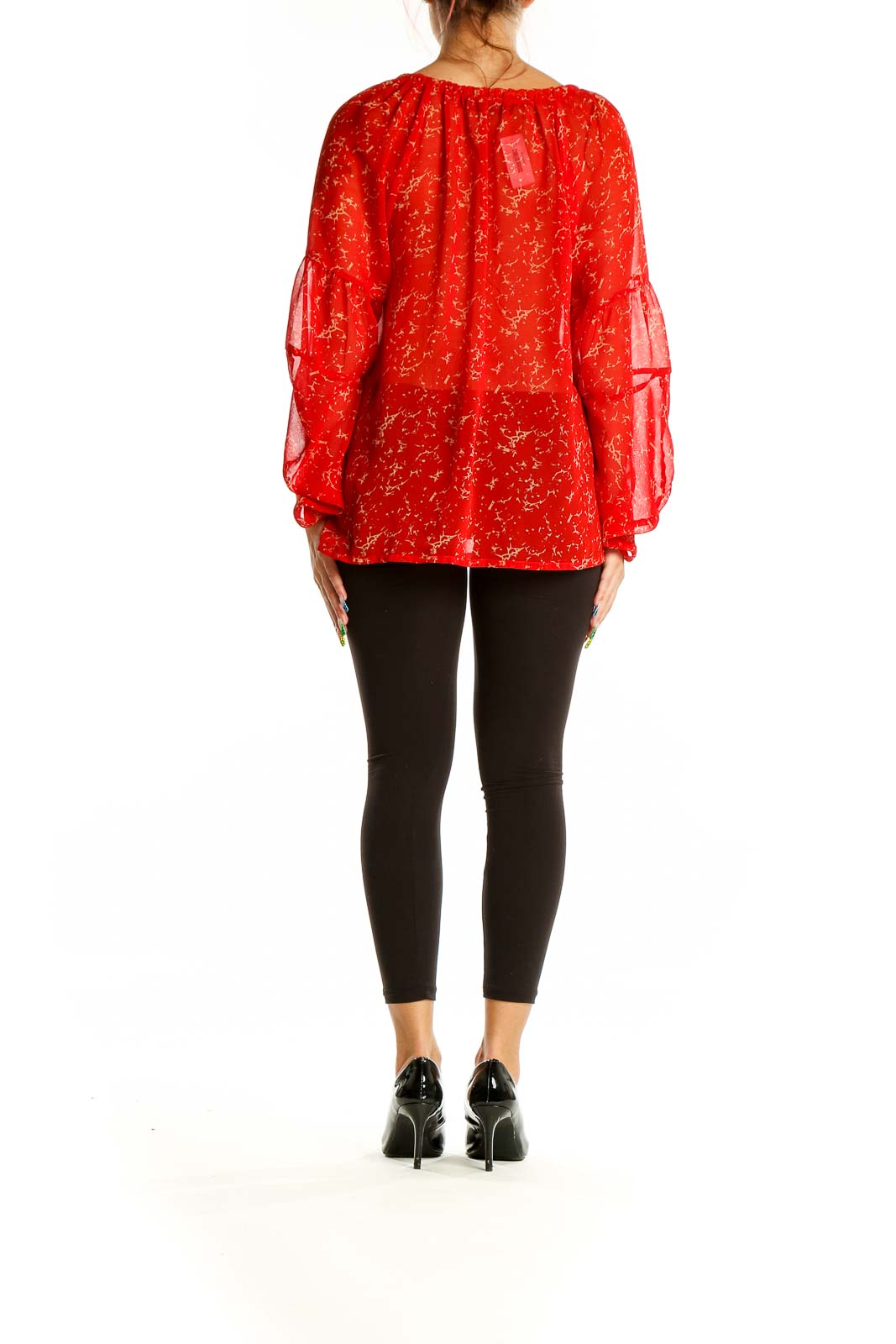 Back view of red sheer peasant blouse showing bell sleeves and flowy silhouette